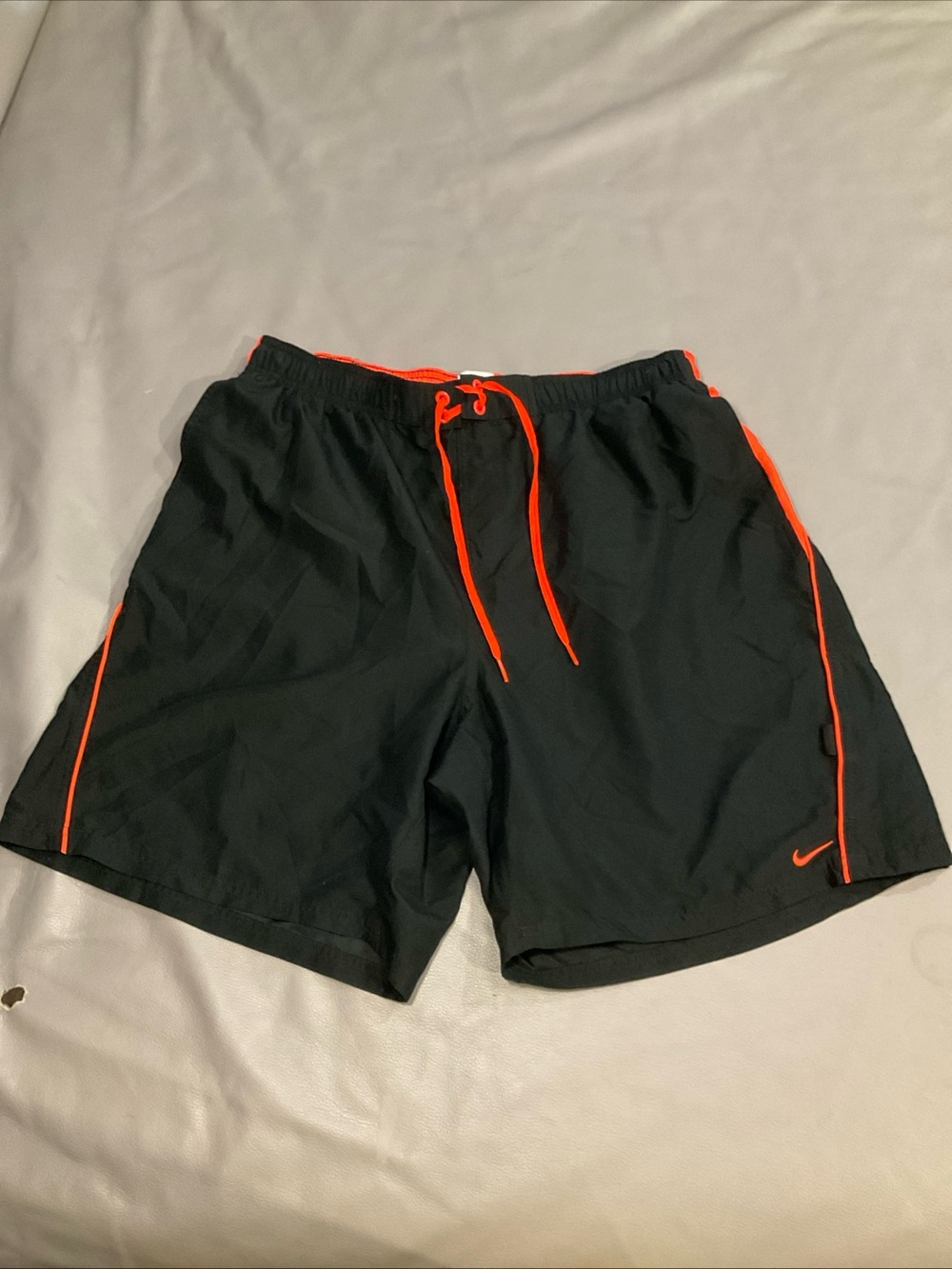 Nike Black Athletic Shorts with Orange Trim and Drawstring